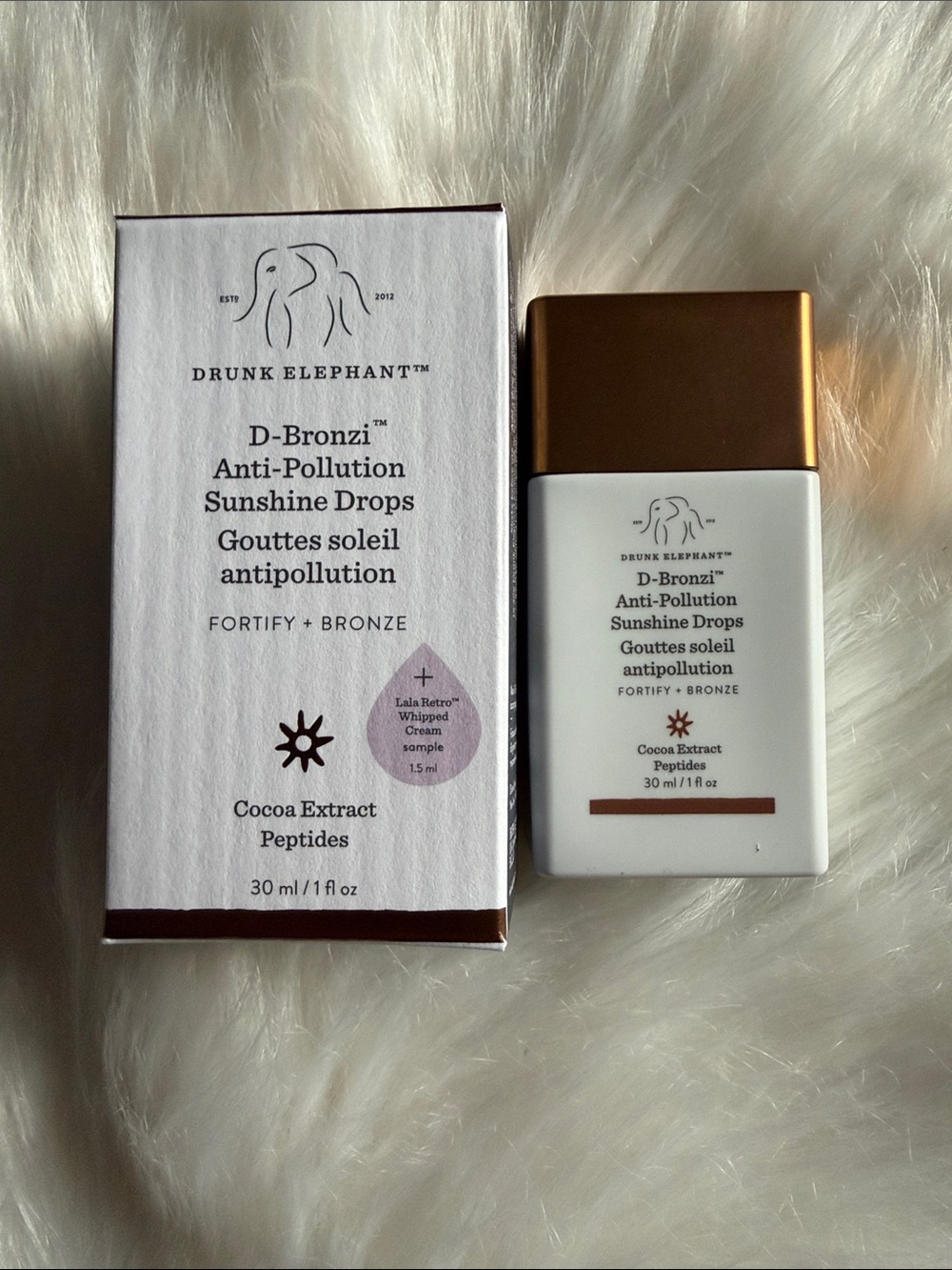 Drunk Elephant D-Bronzi Anti-Pollution Sunshine Drops — white & bronze
